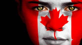 Image of a Canadian flag painted on a young boy's face